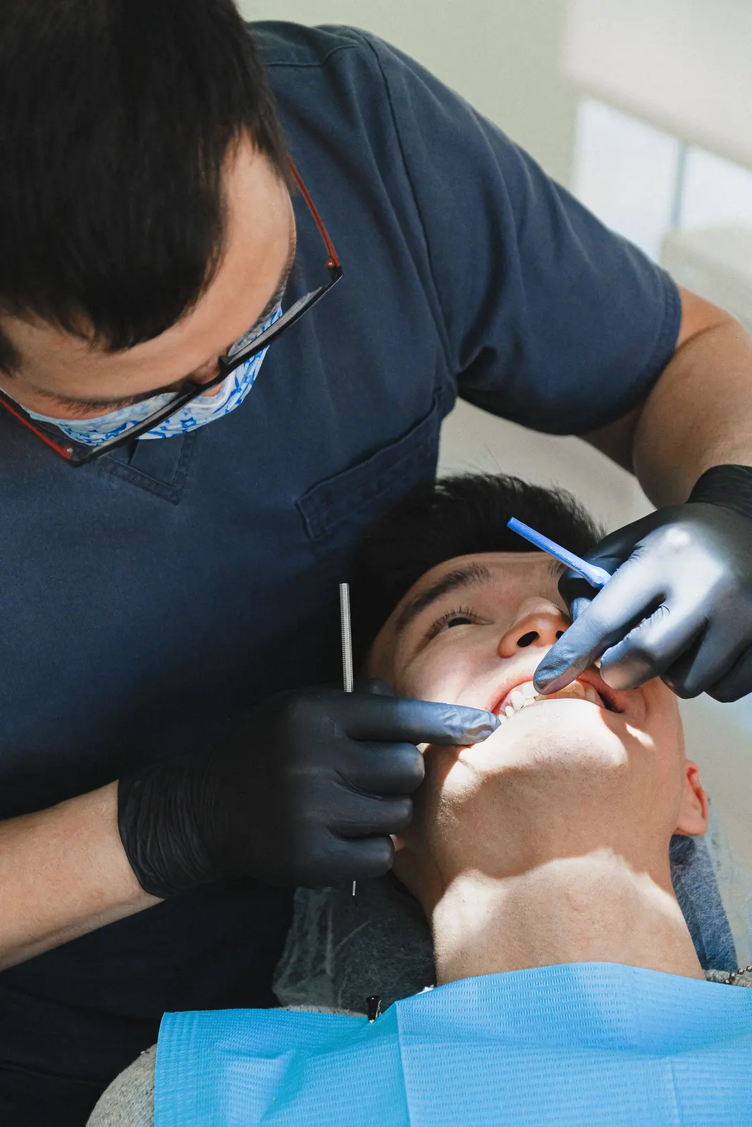 Careful chairside work on a single tooth, alongside the Full Mouth Implants explanation in Virginia Beach