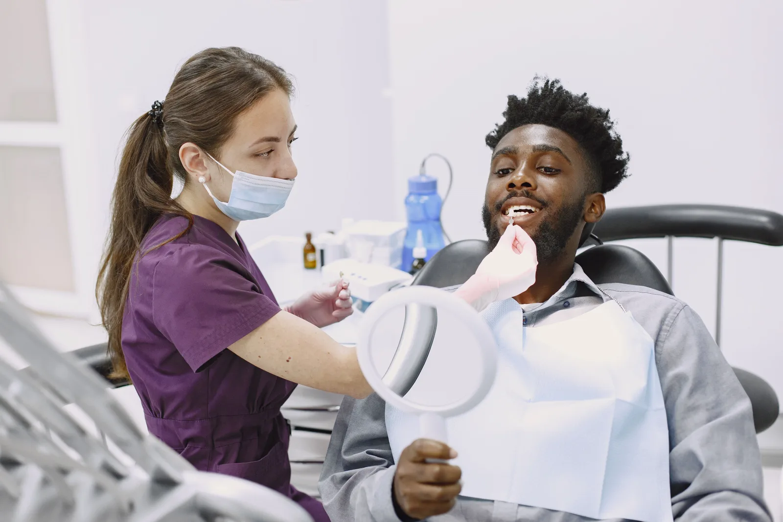 Crown shade checked with a hand mirror, shown while covering Sedation Options in Virginia Beach