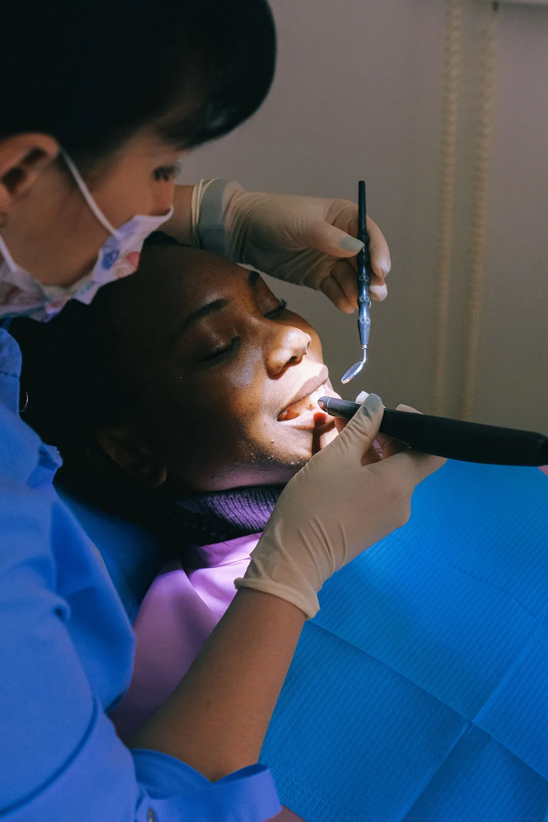 Curing light used during a restoration, referred to in the Full Mouth Implants section for Virginia Beach