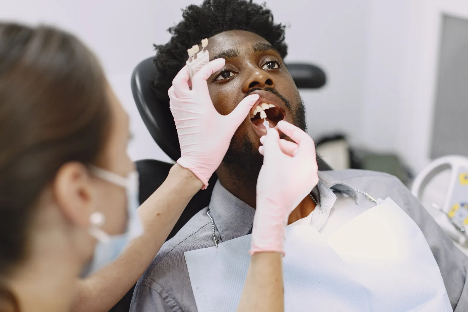 Matching an implant crown shade to the natural teeth, referred to in the Sedation Options section for Virginia Beach