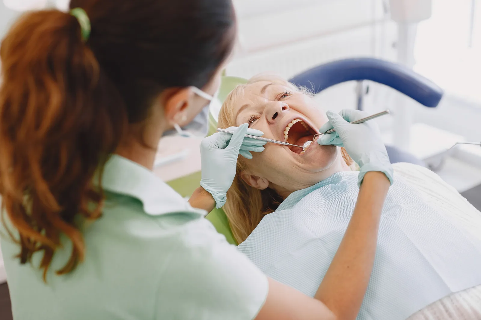 Oral exam before implant planning, alongside the Implant Consultation explanation in Virginia Beach