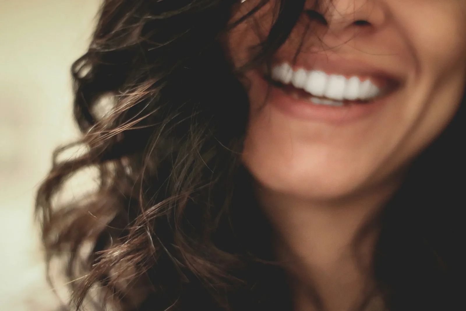 Patient smiling after dental implant treatment, alongside the Ridge Augmentation explanation in Virginia Beach