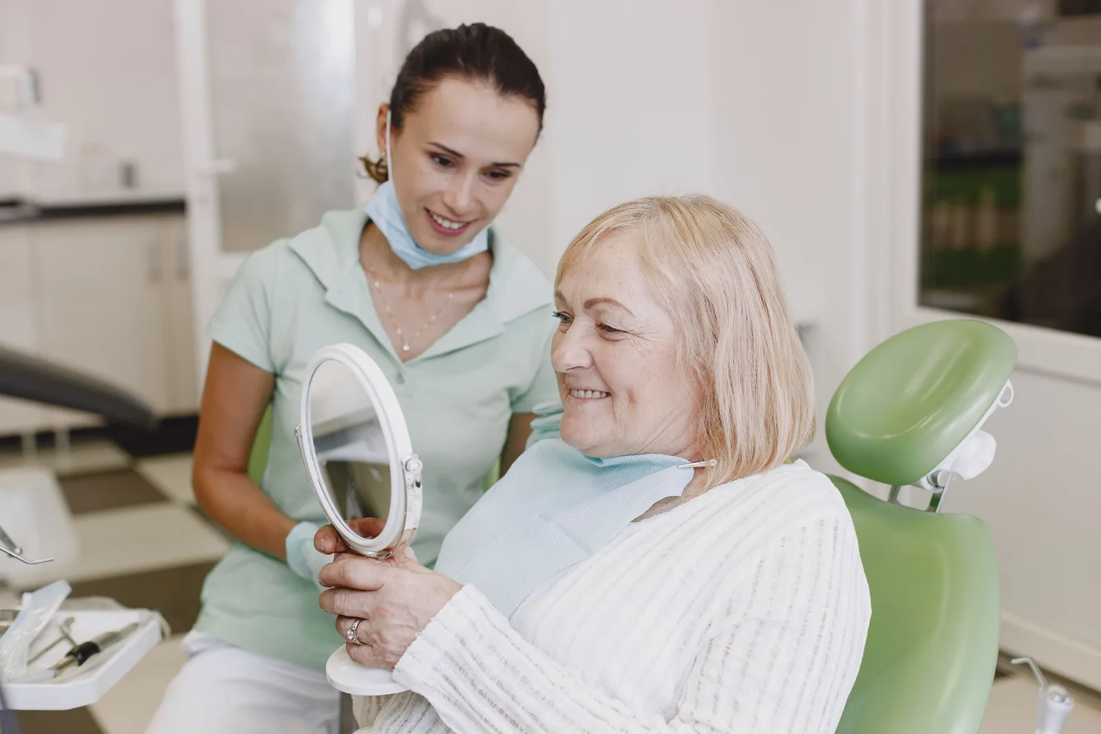 Reviewing the finished smile with the patient, alongside the Implant Lifespan explanation in Virginia Beach