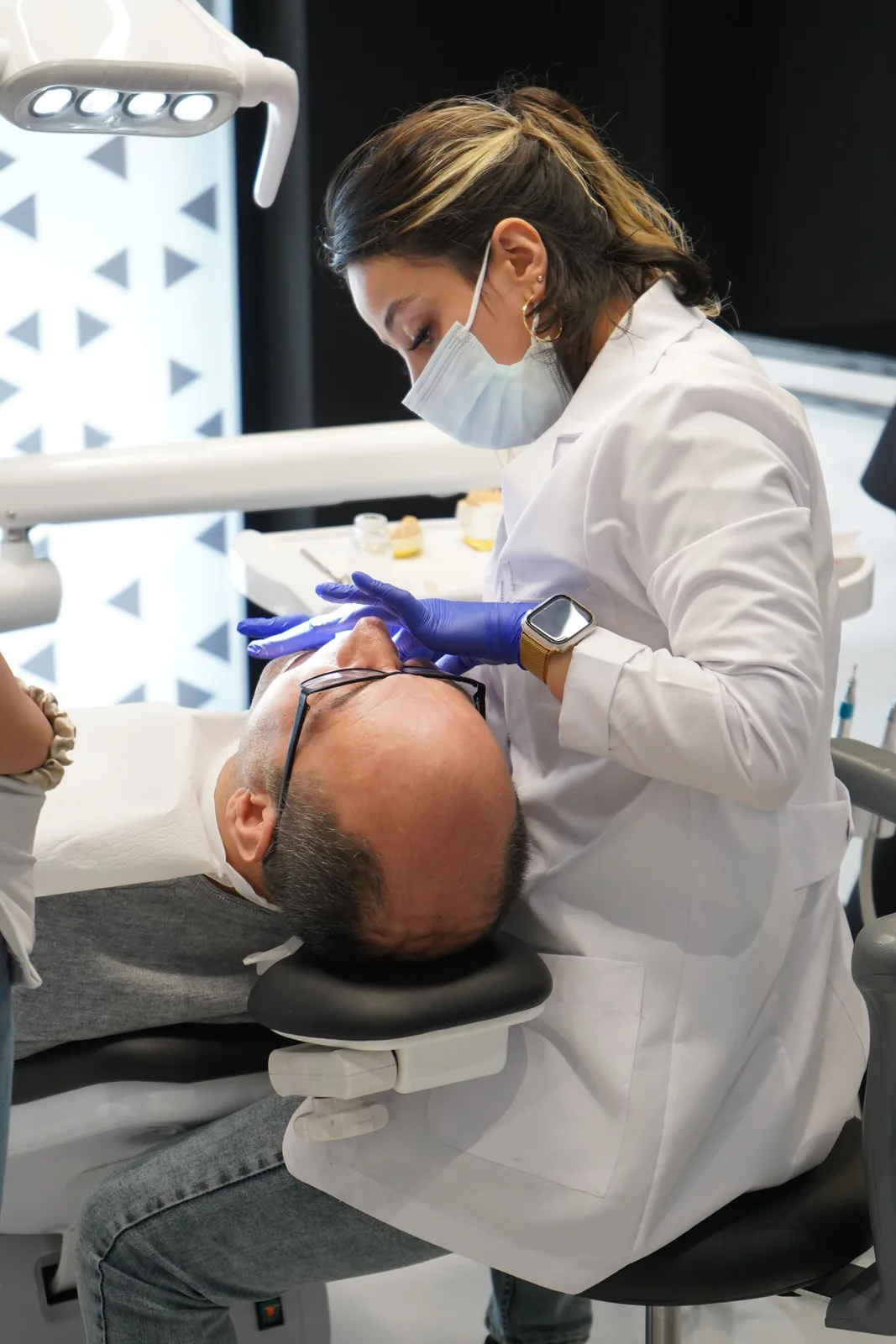 Treatment in a modern operatory, shown while covering Full Mouth Implants in Virginia Beach