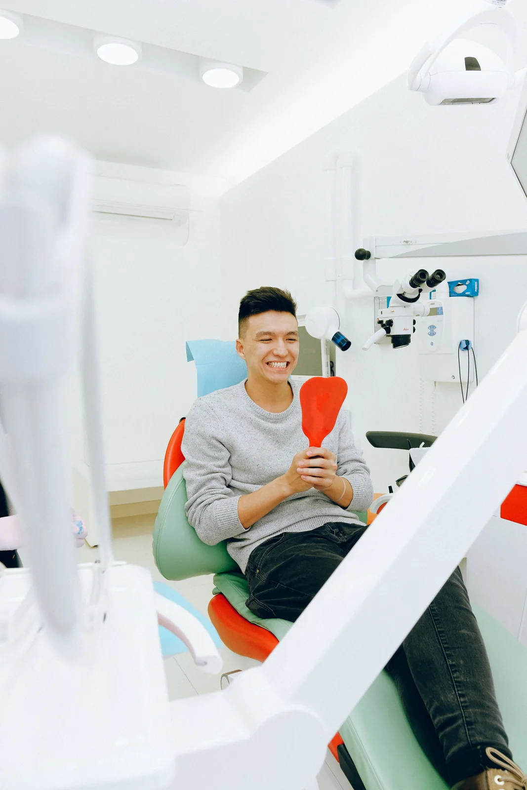 Young patient pleased with the result, referred to in the Front Tooth Implant section for Virginia Beach